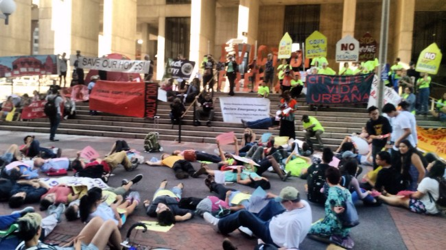 Image of Boston City Hall "Die In" Sep 22, 2016 likely due to Eli Gerzon, Twitter, https://twitter.com/eligerzon/status/779059797580742656. Editorial use.