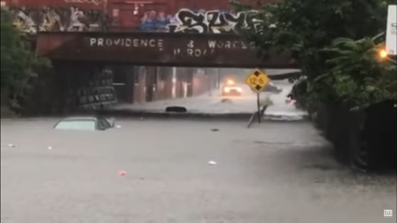 Screenshot of video of flooding in Cambridge St, Worcester, July 2018 with the tops of two cars visible in flood water approximately four feet deep. Screenshot of YouTube video by the Telegram and Gazette.