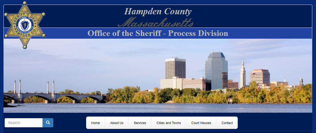 The website for the Hampden County, Massachusetts Sheriff shows the traditional six-pointed Sheriff's badge as well as the Springfield city skyline.