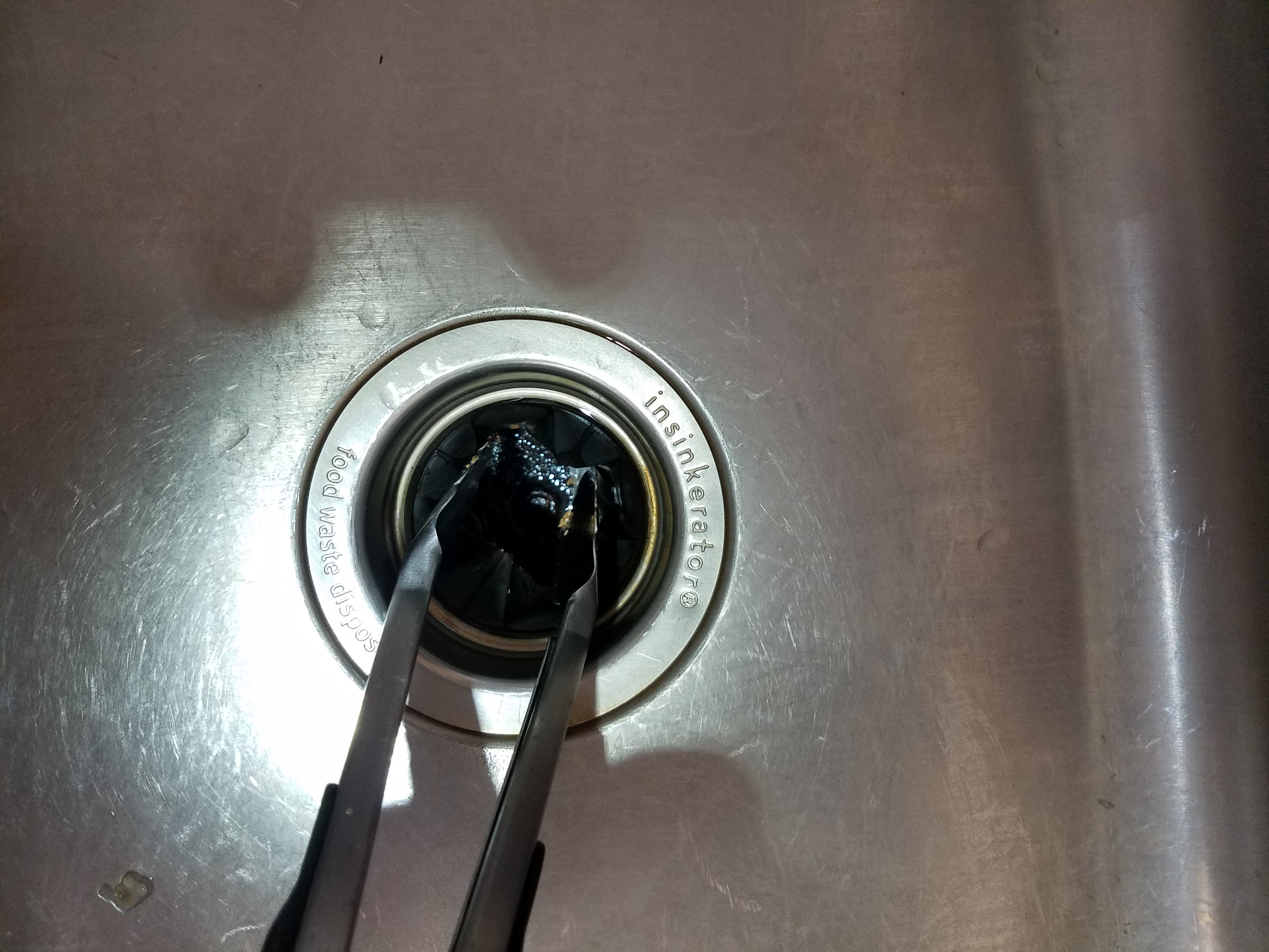 how to fix a garbage disposal step five