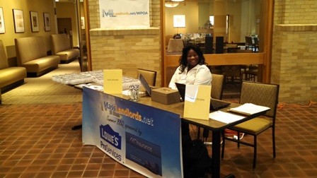 Co-organizer Maryse Constant sitting at the check-in desk prior to the event.