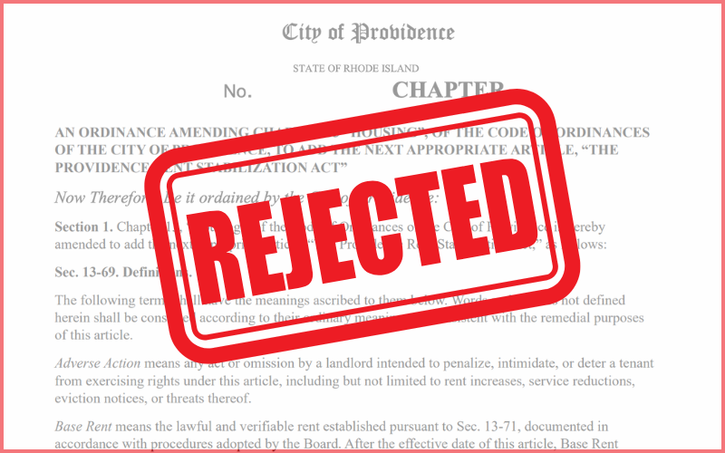 A blurred image of the front page of the Providence rent control proposal has a red “rejected” stamp over it.