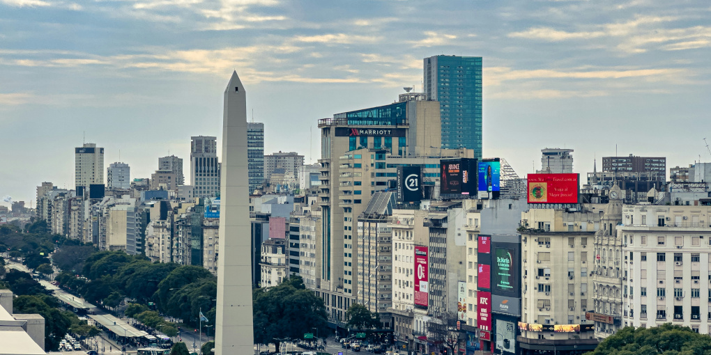 A skyline view of the center of Buenos Aires featuring the obelisk in Plaza de la República.