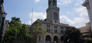 Photo of the western housing court building, in ornate, gothic architectural style, on Elm Street in Springfield, Mass., on a sunny day.