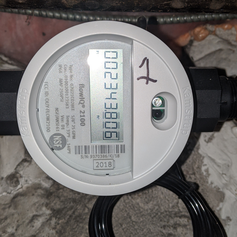 Image of a flow iq water submeter in a basement